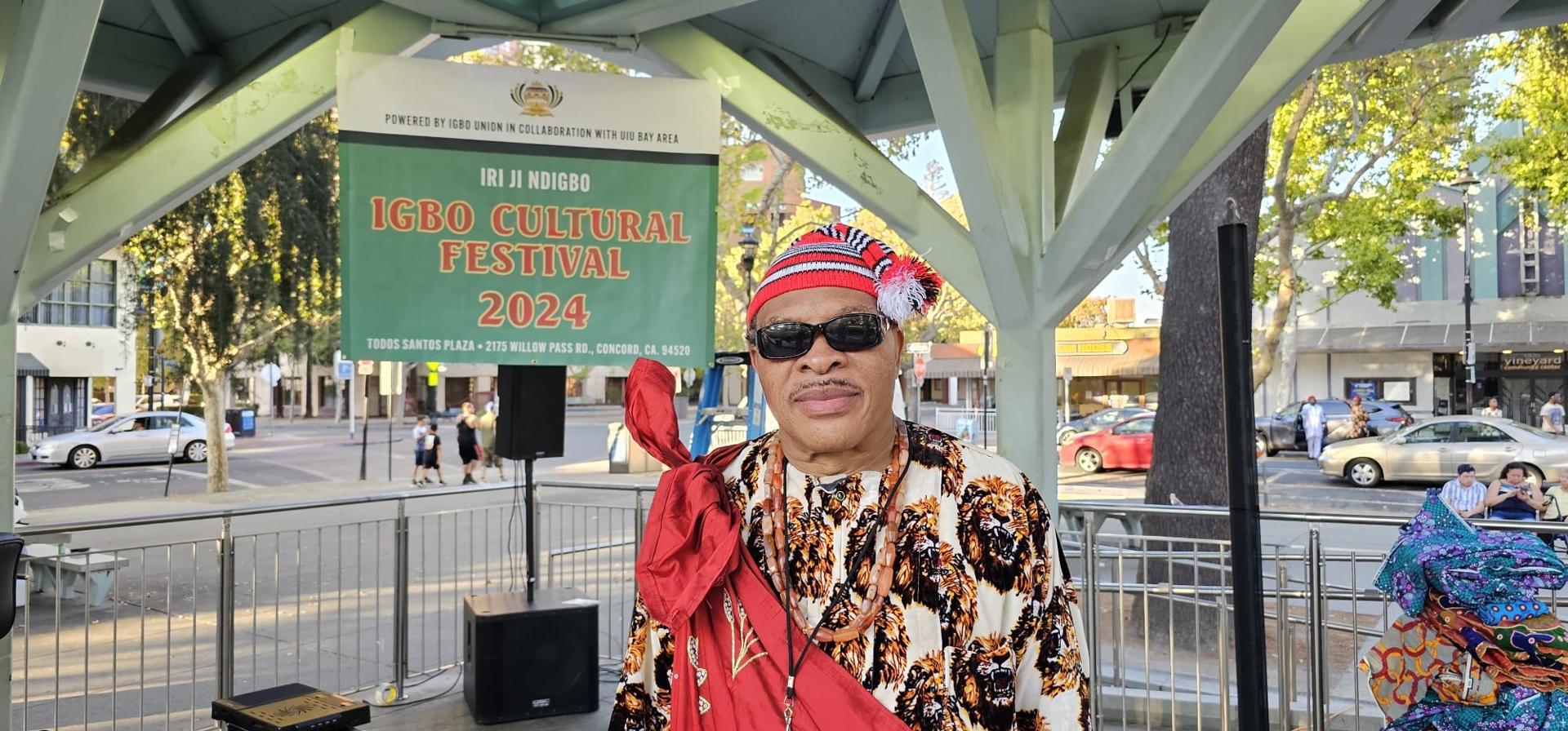 Community member in traditional attire at an Igbo cultural festival