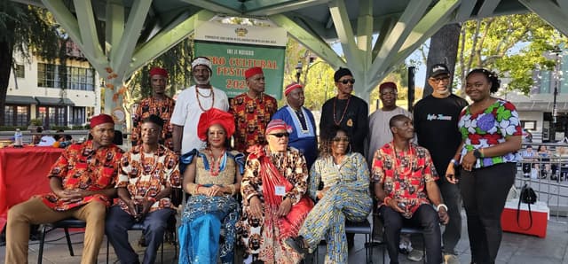 Igbo Union members gathered beneath a cultural festival banner